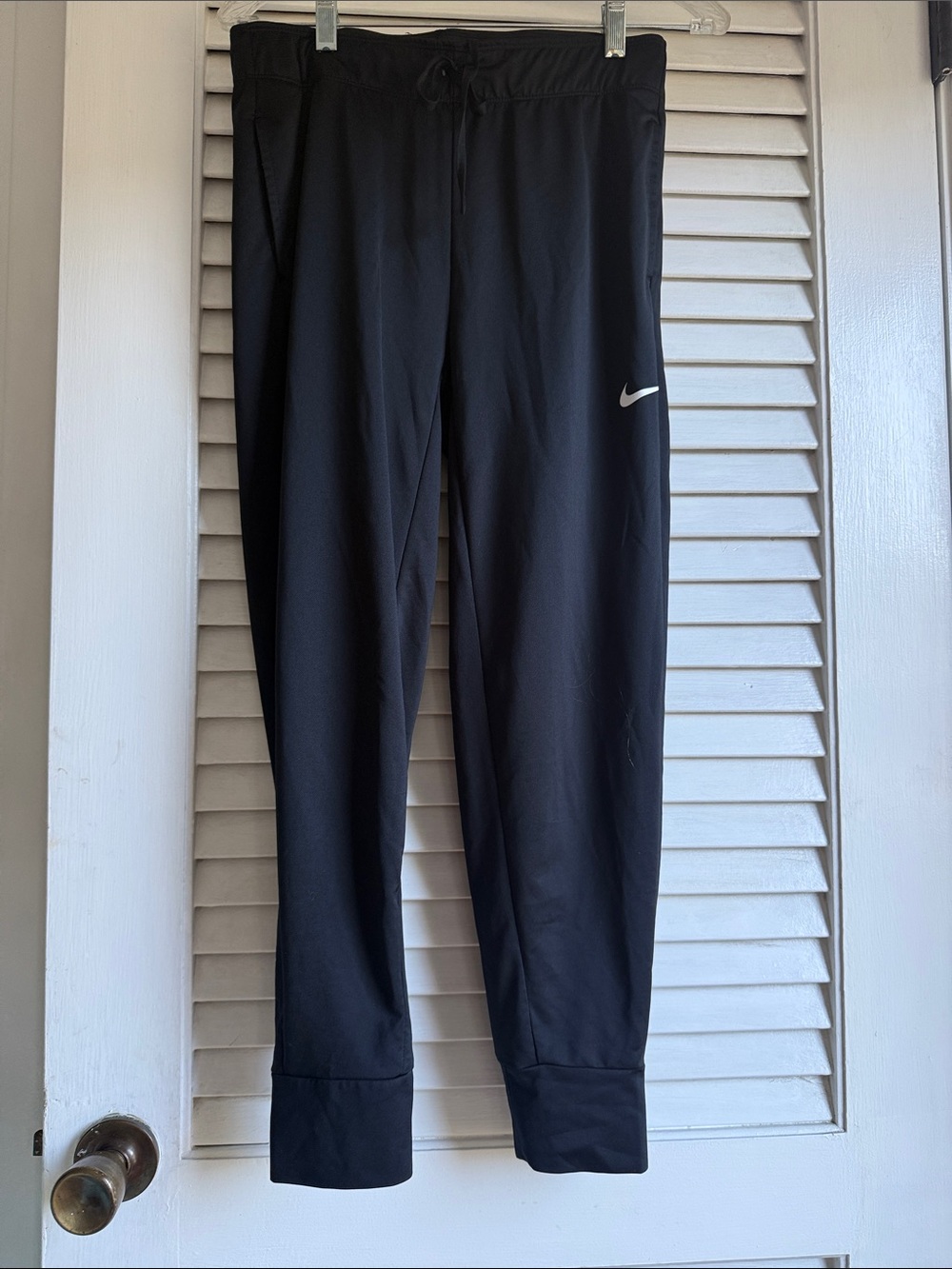 Nike dri fit pants with pockets and cuffed at the bottom